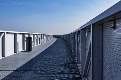 Footbridge against sky