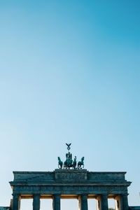Low angle view of statue against clear sky