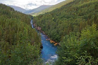 High angle view of river flowing through rocks