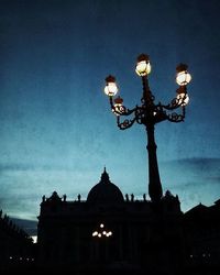 Low angle view of illuminated building against sky at night