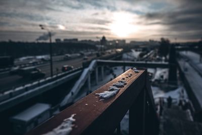 Railroad tracks against sky during sunset