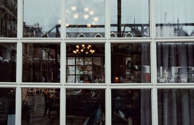 Reflection of building on glass window