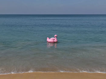 View of person in sea against sky