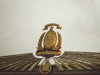 Low angle view of statue against sky