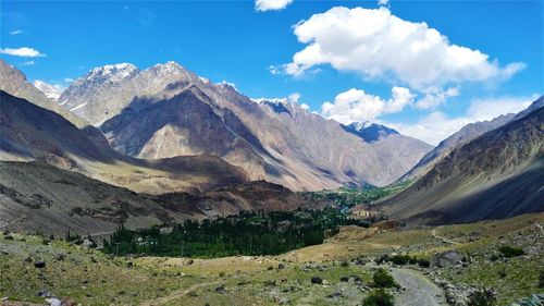 Scenic view of landscape and mountains against sky