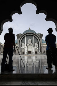 Men standing at temple