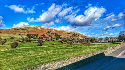 Scenic view of landscape against cloudy sky