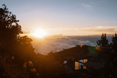 Scenic view of buildings against sky during sunset