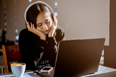 Young woman using laptop