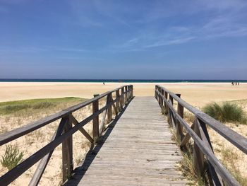 Pier over sea against sky