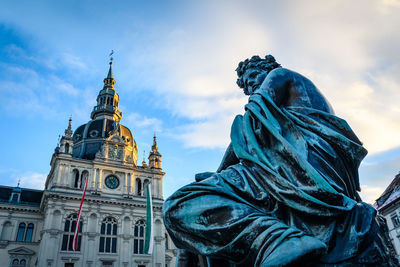 Low angle view of statue of building against sky