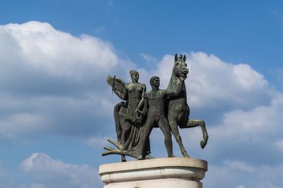 Low angle view of statue against sky