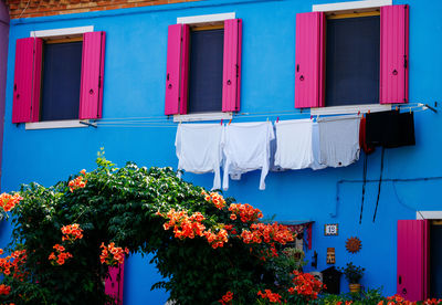 Vibrant houses along the canal in burano, italy, highlight unique architecture 