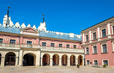 Low angle view of historical building against blue sky