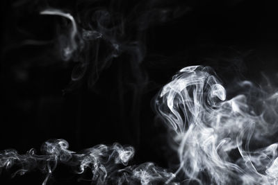 Close-up of smoke against black background