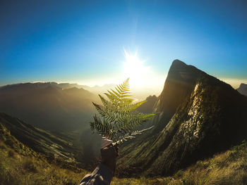 Scenic view of mountains against clear blue sky
