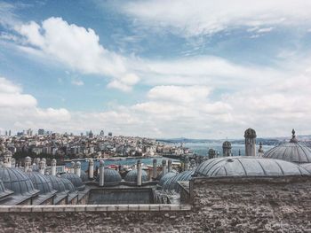 High angle view of townscape against cloudy sky