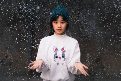 Portrait of a smiling woman in snow