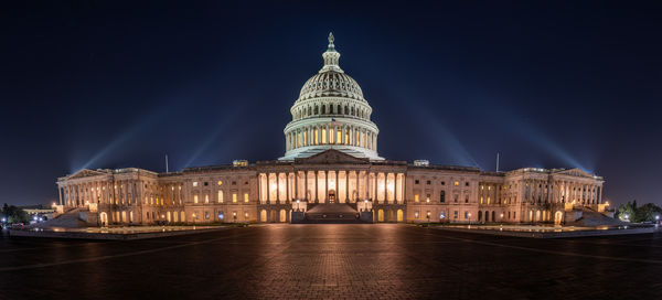 Panorama of the illuminated u.s. capitol building in washington d.c. at night