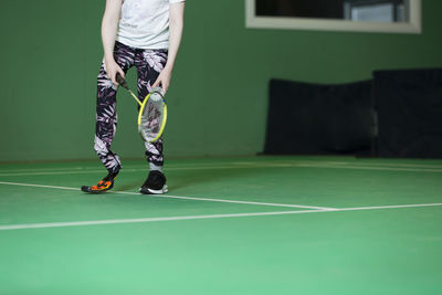 Girl with artificial leg playing badminton