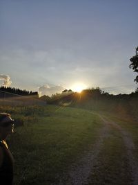 Scenic view of field against sky during sunset