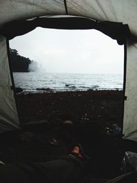 Scenic view of sea seen through window