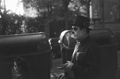 Young man looking away while sitting in car