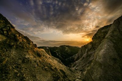 Scenic view of landscape against cloudy sky