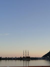 Scenic view of sea against clear sky during sunset