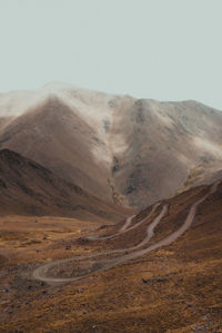 Road through the mountains and clouds