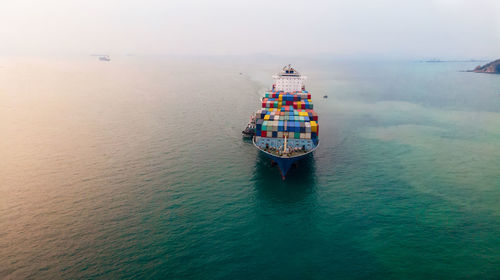 High angle view of ship sailing in sea against sky