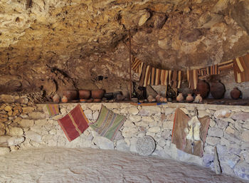 Clothes hanging on rock against wall