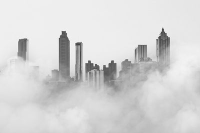 View of buildings in city against sky