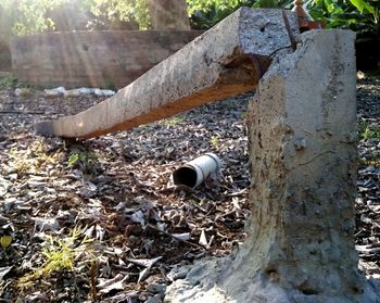 High angle view of abandoned bottle on field