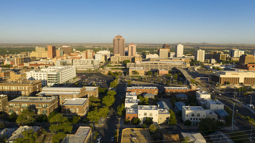 High angle view of buildings in city against sky