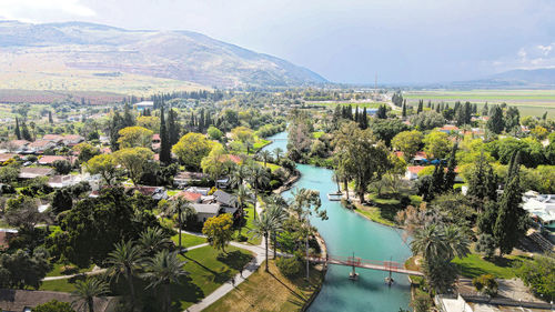 High angle view of river amidst buildings in city