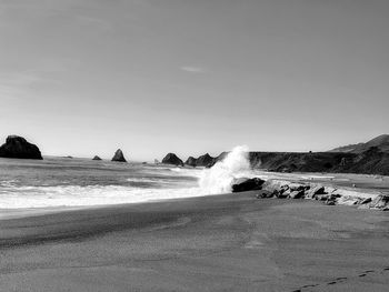 Scenic ocean crashing waves landscape against shore. 