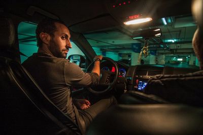 Man sitting in car