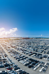 Aerial view of cityscape against clear blue sky