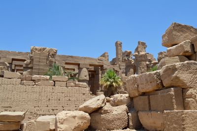 Low angle view of old ruins against clear sky