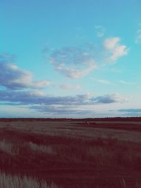 Countryside landscape against blue sky and clouds