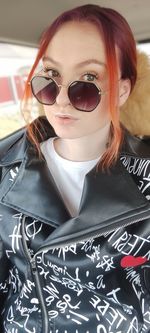 Portrait of young woman wearing sunglasses