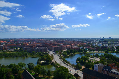 High angle view of river amidst buildings in city against sky