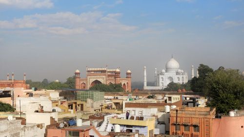 Buildings in city against sky