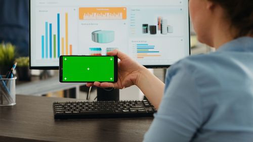 Midsection of woman using mobile phone