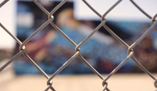 Grafitti through fence, dtla arts district 