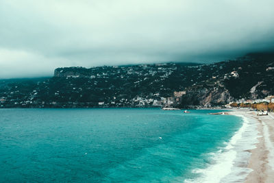 Scenic view of sea against cloudy sky