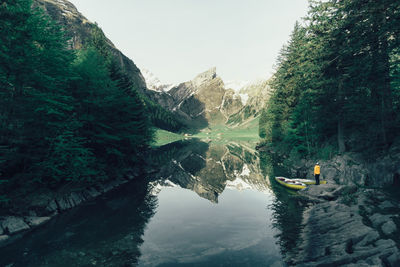 Scenic view of mountain reflecting in lake