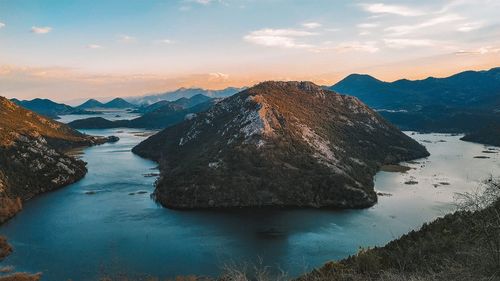 Scenic view of snowcapped mountains against sky during sunset