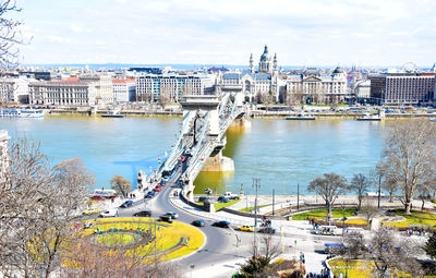 High angle view of bridge over river in city against sky